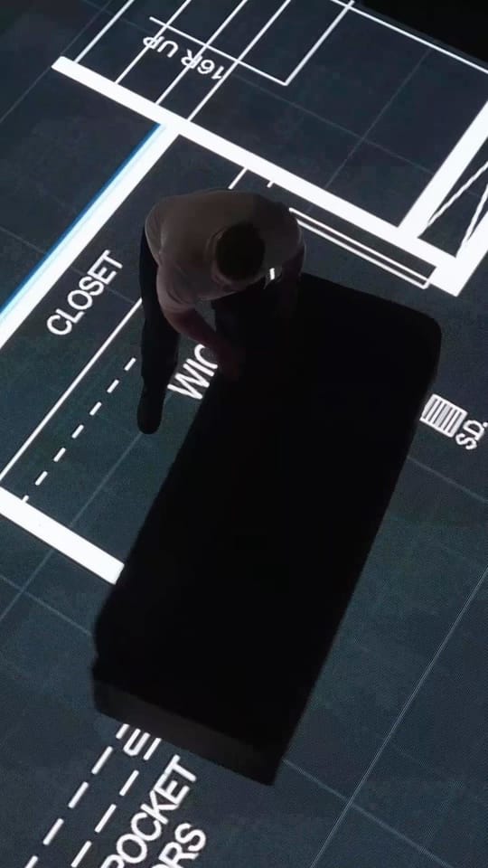 The Calgary studio's LED floor and wall-size screen, seen from the doorway