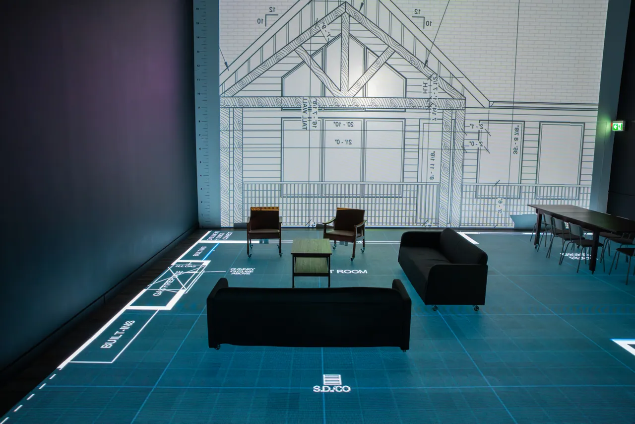 The complete studio with real furniture and a full-scale house elevation